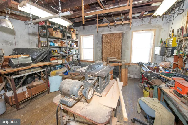 a storage room with lots of wooden furniture