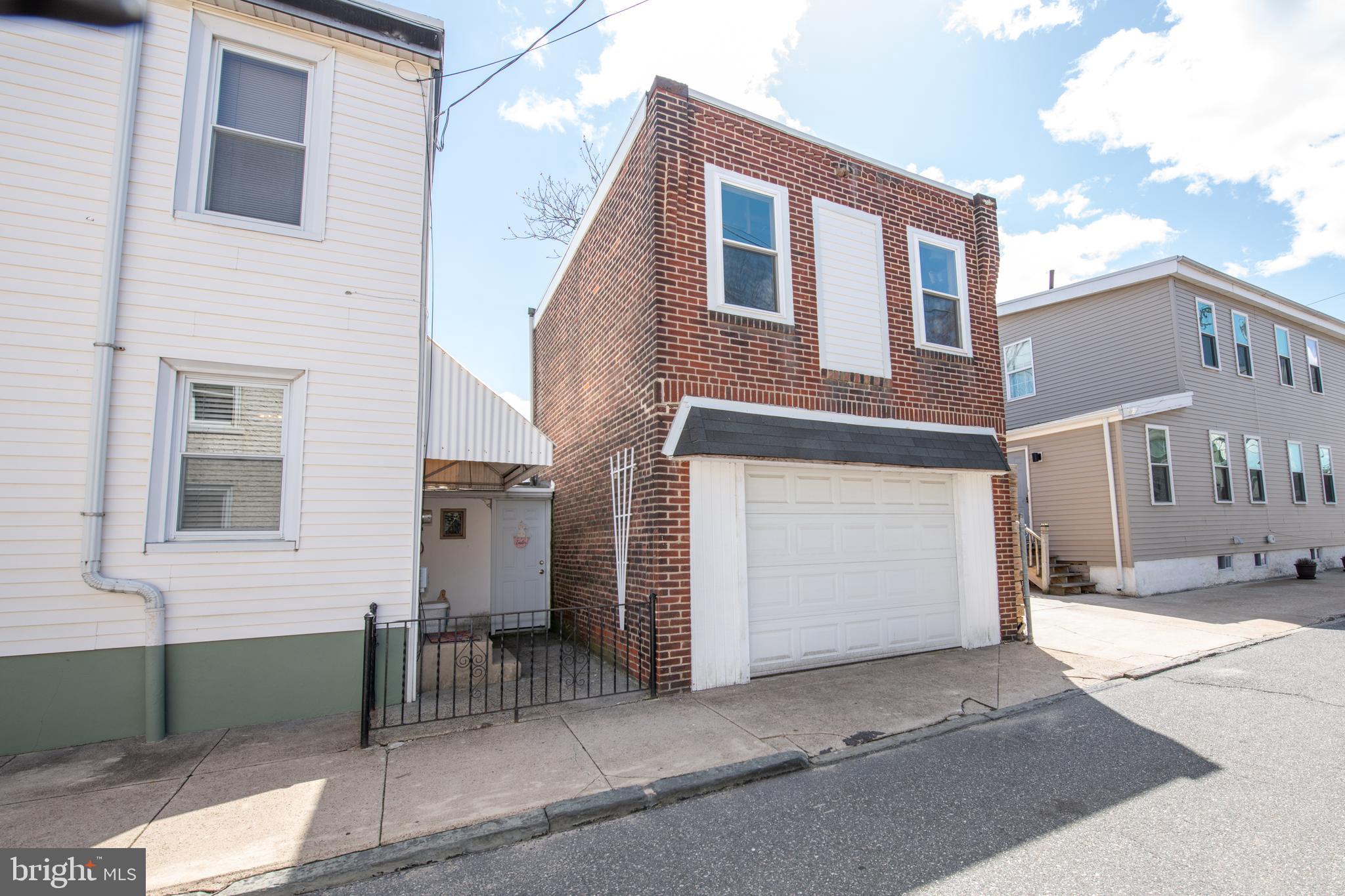 2740 Pratt Street Philadelphia, PA 19137 - Photo 5 of 45 a front view of a house with a garage