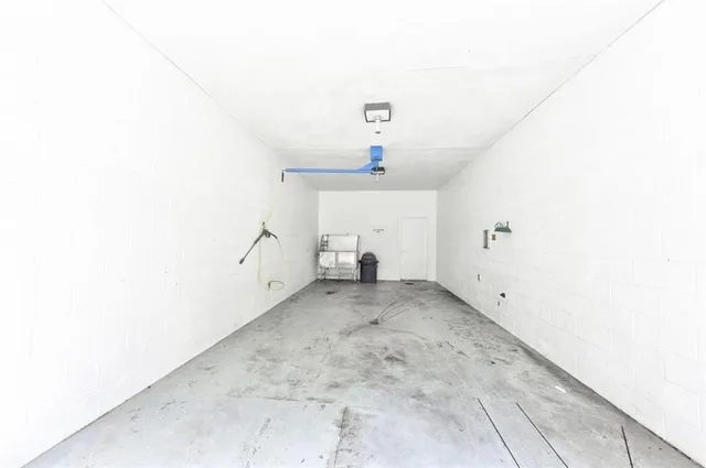 a view of a swimming pool with outdoor seating