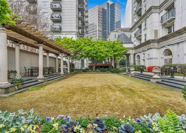 a living room with lots of furniture and a chandelier