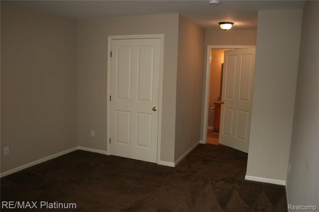 4074 Hampton Ridge Boulevard, Unit 58 Howell, MI 48843 - Photo 15 of 37 Master Bedroom has walk in closet & full bath