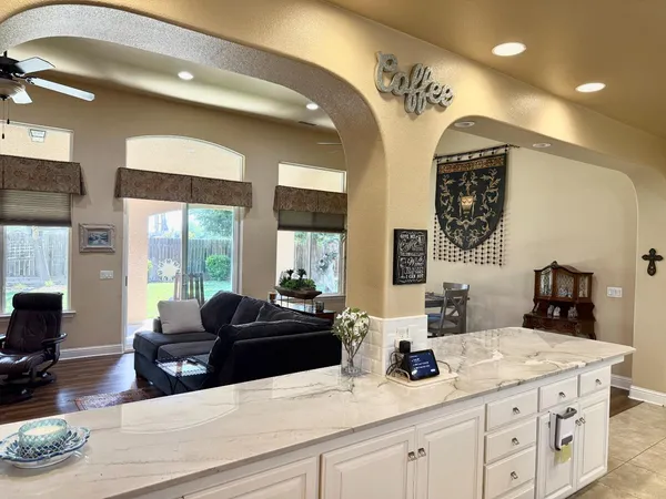 a dining room with furniture and window