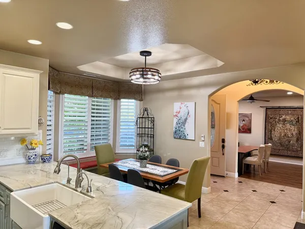 a view of a livingroom with furniture and wooden floor