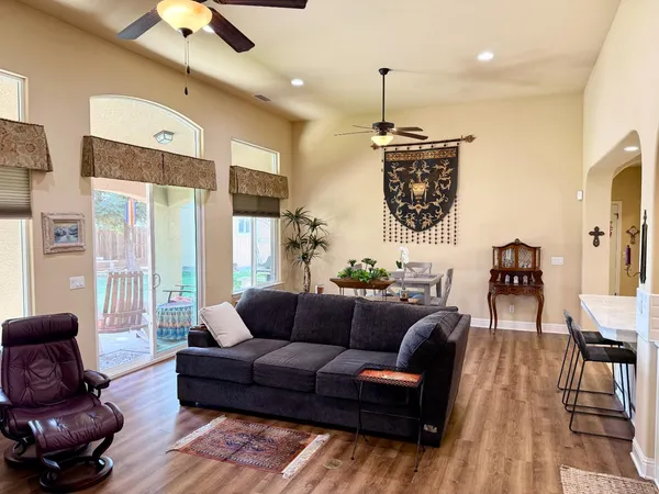 a living room with fireplace furniture and a flat screen tv