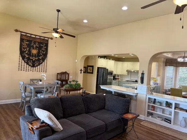 a room with a sink and a wooden floor