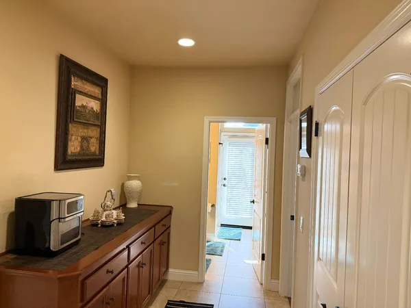 a room with lots of furniture and a rug