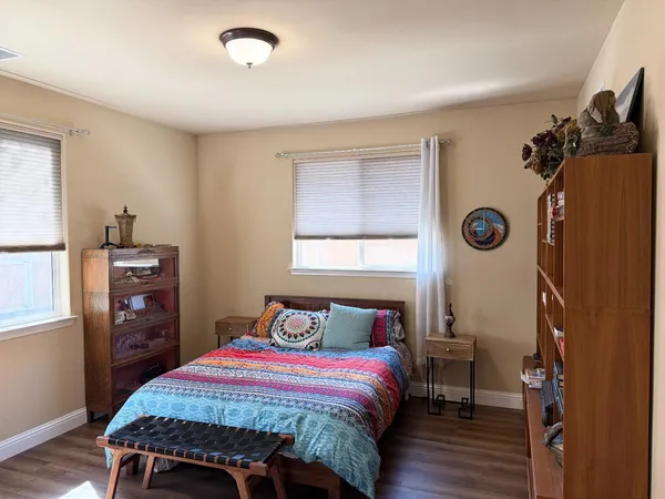 a bathroom with a sink mirror and toilet