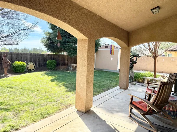a front view of a house with garden and porch