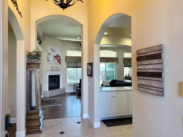 a view of living room with furniture and fireplace