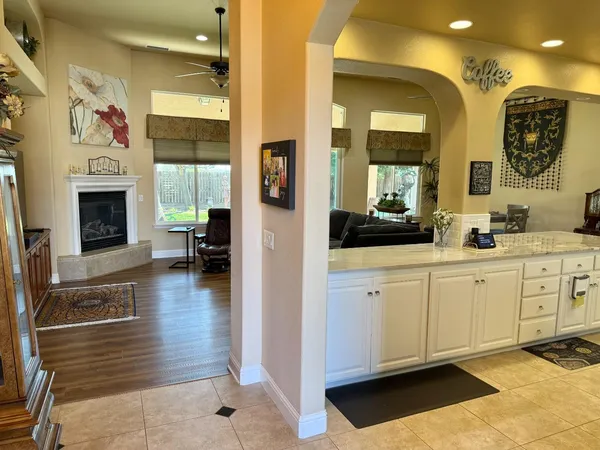 a view of living room with furniture and fireplace