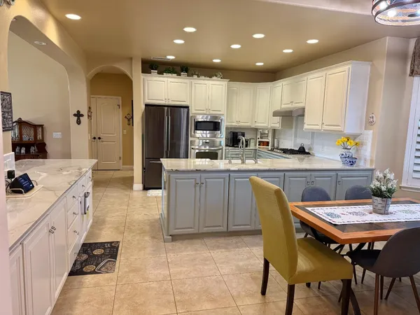 a living room with furniture and flat screen tv