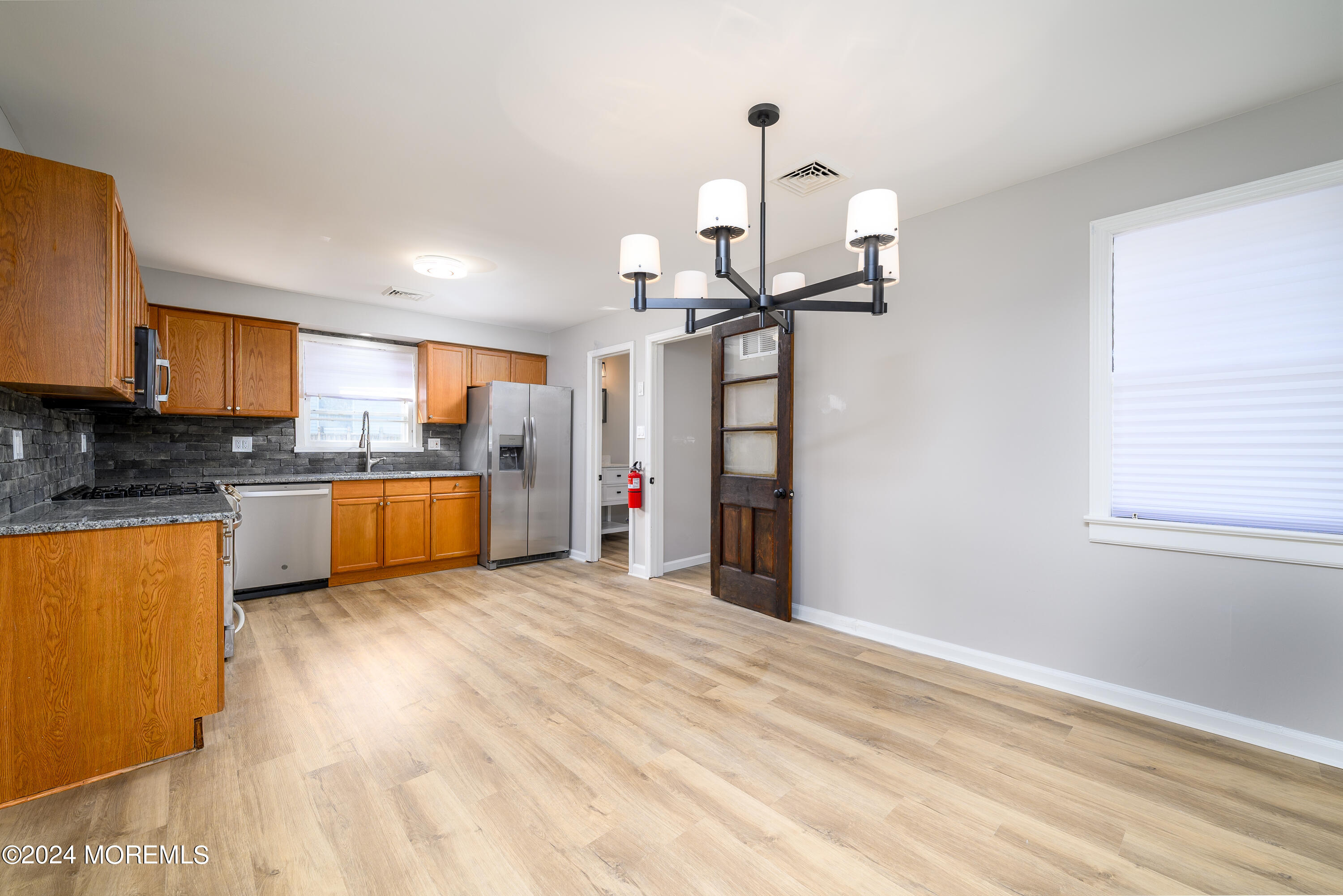 554 Lillie Road Toms River, NJ 08753 - Photo 15 of 26 a view of a kitchen with sink microwave and cabinets