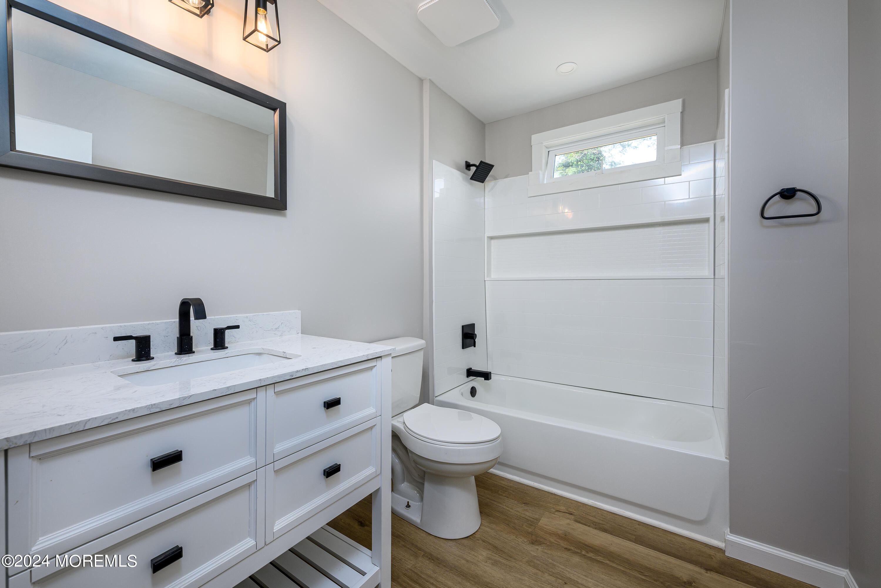 554 Lillie Road Toms River, NJ 08753 - Photo 16 of 26 a bathroom with a sink a toilet and shower