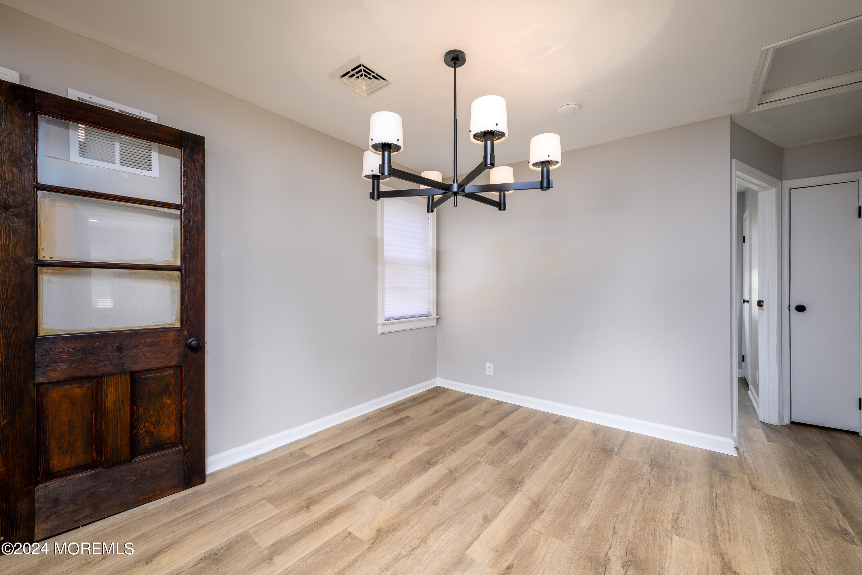 554 Lillie Road Toms River, NJ 08753 - Photo 19 of 26 a view of empty room with wooden floor