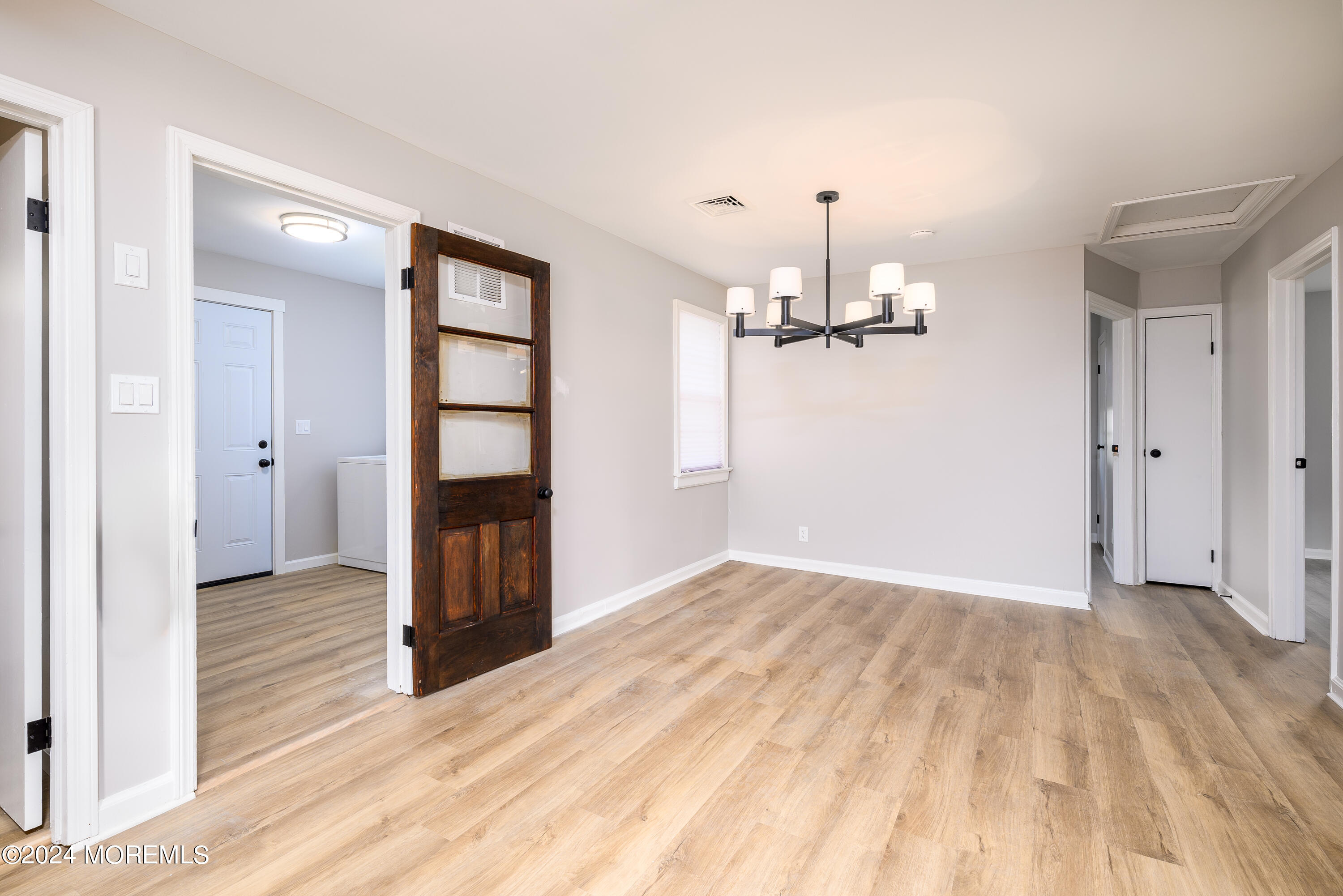 554 Lillie Road Toms River, NJ 08753 - Photo 20 of 26 a view of empty room with wooden floor and window