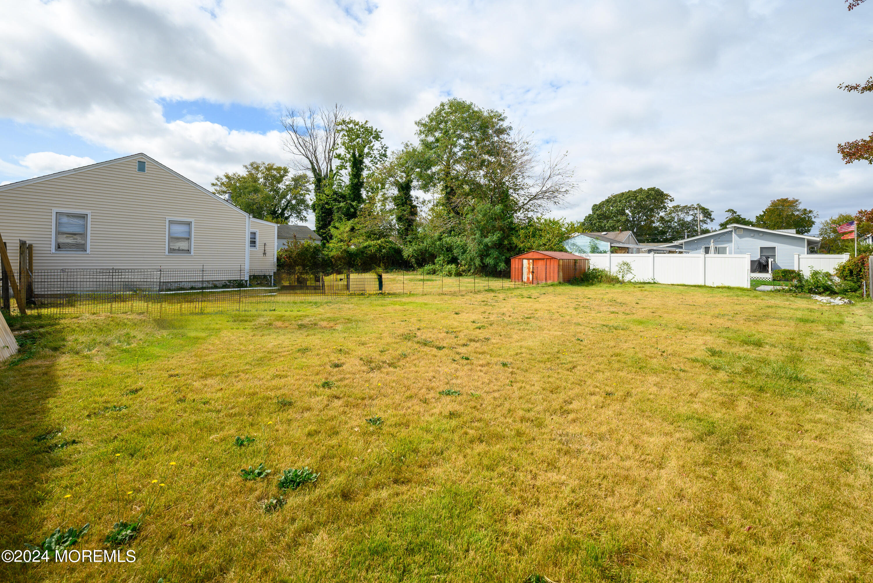 554 Lillie Road Toms River, NJ 08753 - Photo 24 of 26 a swimming pool with trees in front of it