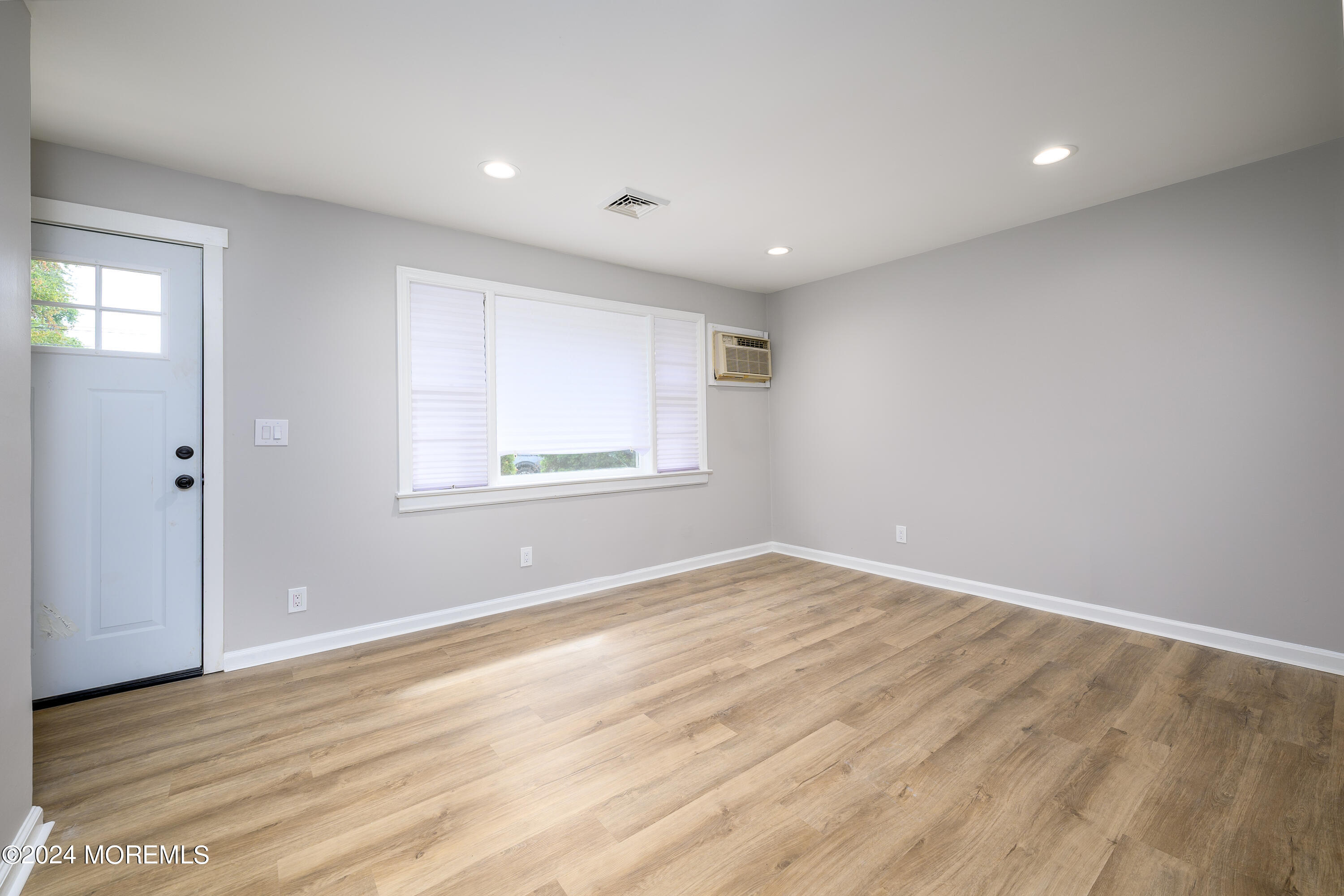 554 Lillie Road Toms River, NJ 08753 - Photo 6 of 26 wooden floor in an empty room with a window