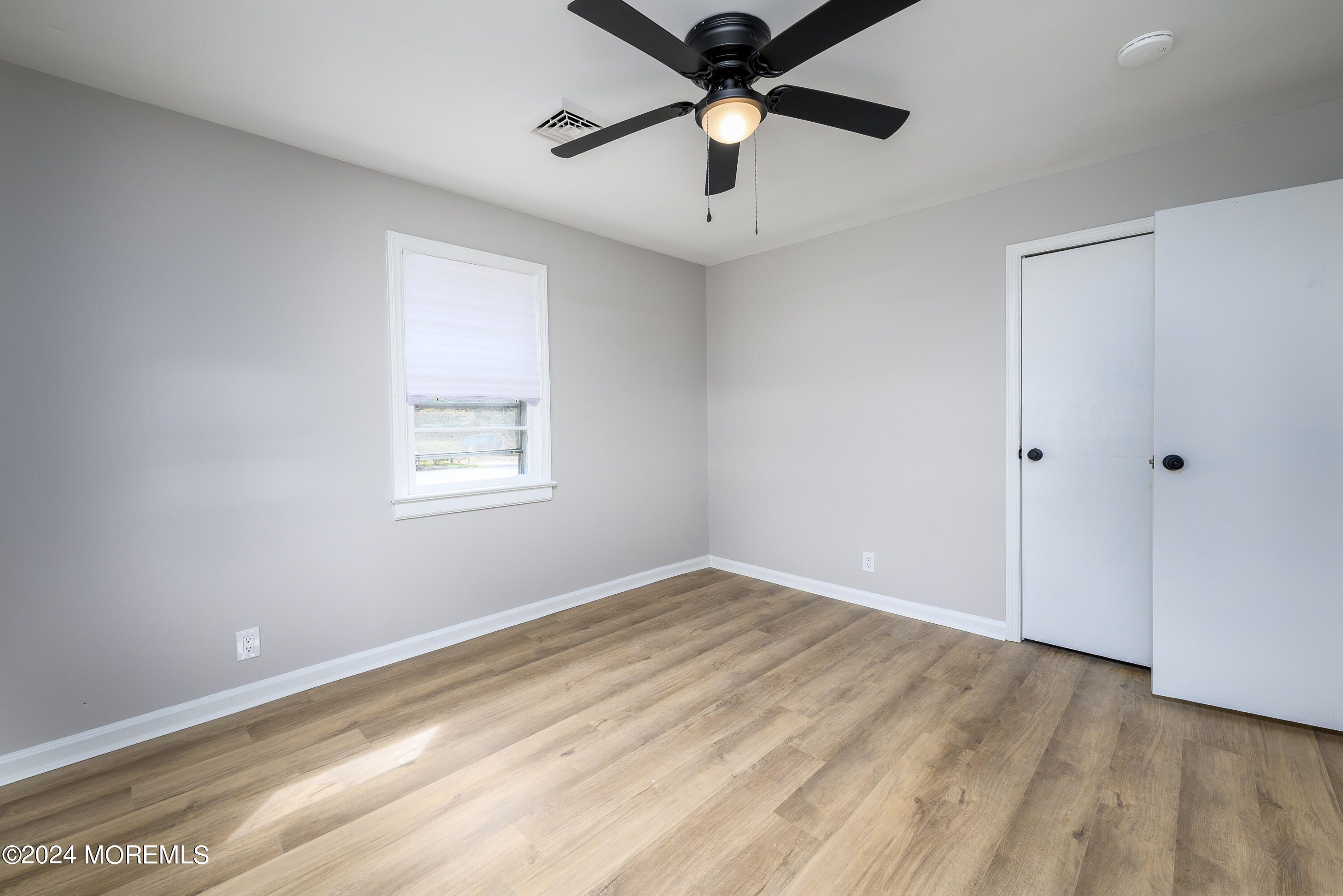 554 Lillie Road Toms River, NJ 08753 - Photo 10 of 26 a view of an empty room with a window