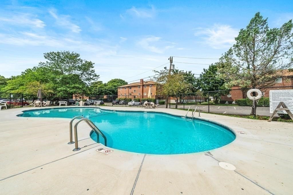 50 Bryon Road, Unit 3 Boston, MA 02467 - Photo 8 of 8 a view of a swimming pool with a patio