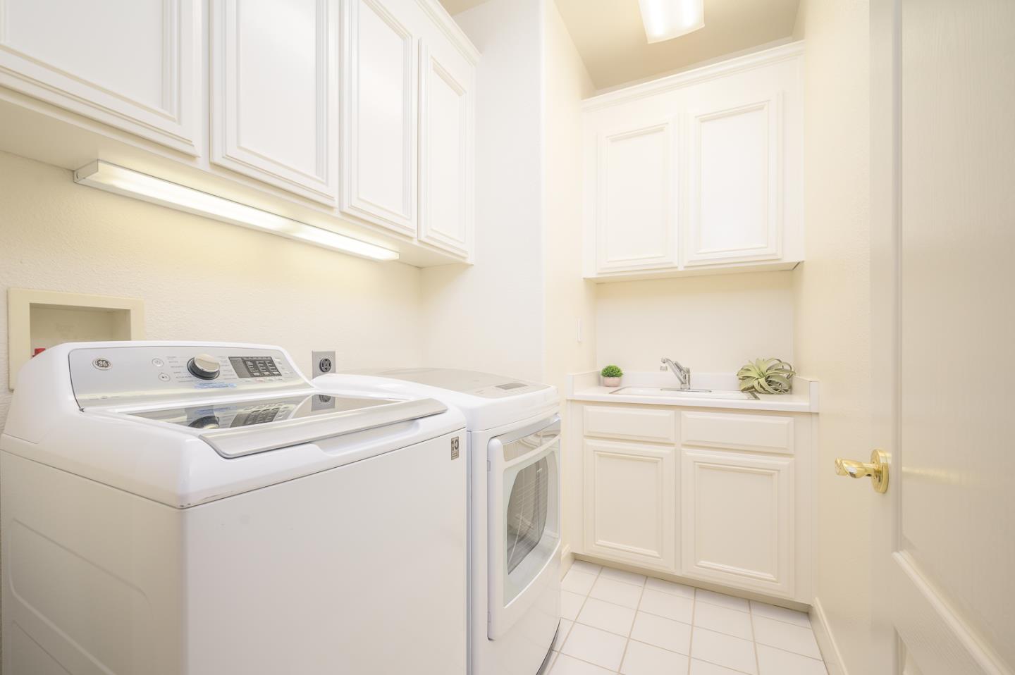 1791 Woodhaven Place Mountain View, CA 94041 - Photo 25 of 26 a utility room with dryer and washer