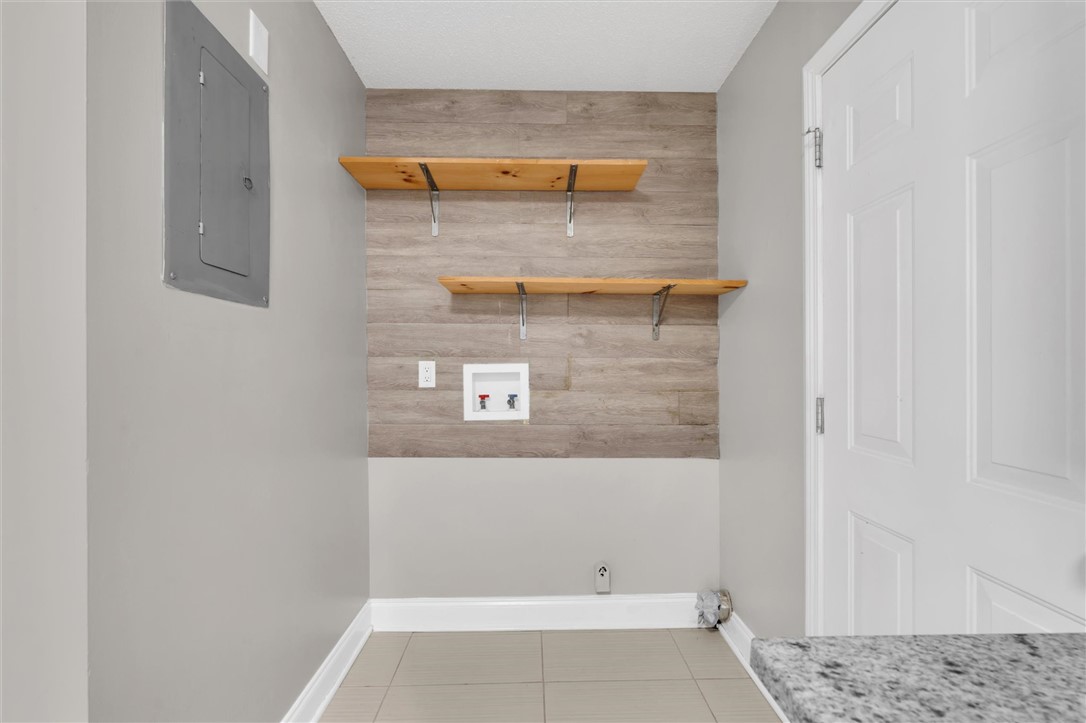 123 Trailside Lane Greenville, SC 29607 - Photo 16 of 29 This dedicated utility space offers practical organization and a clean, modern aesthetic.