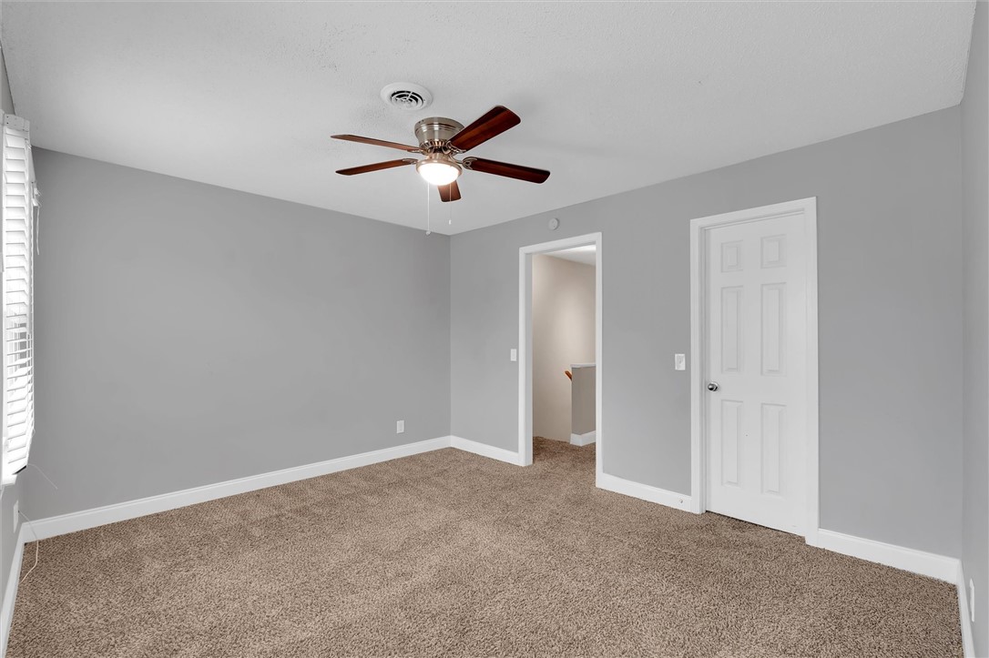 123 Trailside Lane Greenville, SC 29607 - Photo 19 of 29 This inviting bedroom features soft carpet and a cooling ceiling fan, perfect for restful nights.