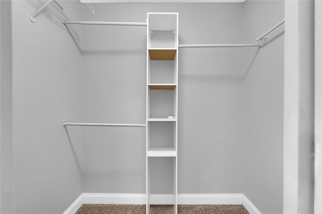 123 Trailside Lane Greenville, SC 29607 - Photo 20 of 29 This organized walk-in closet offers efficient storage with shelving and hanging rods.