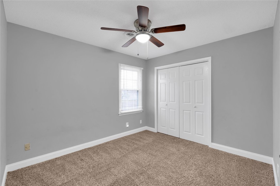 123 Trailside Lane Greenville, SC 29607 - Photo 23 of 29 This spacious bedroom offers comfortable carpeting and a bright window for natural light.