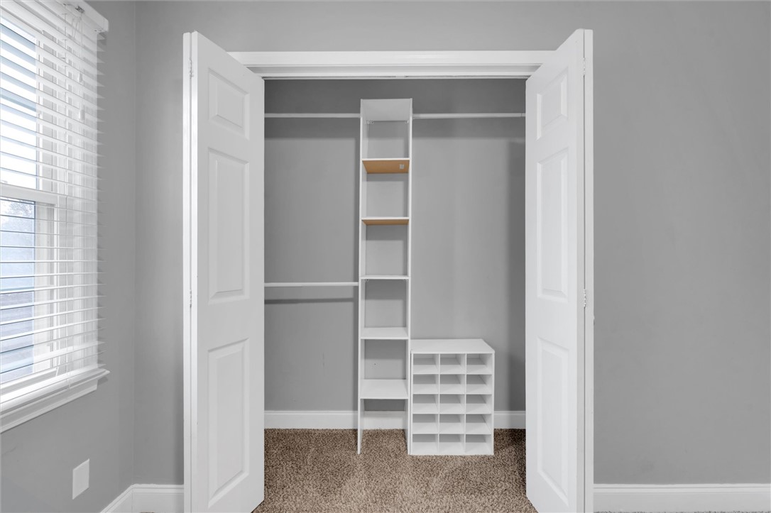 123 Trailside Lane Greenville, SC 29607 - Photo 25 of 29 This organized closet features ample storage solutions for clothing and accessories.