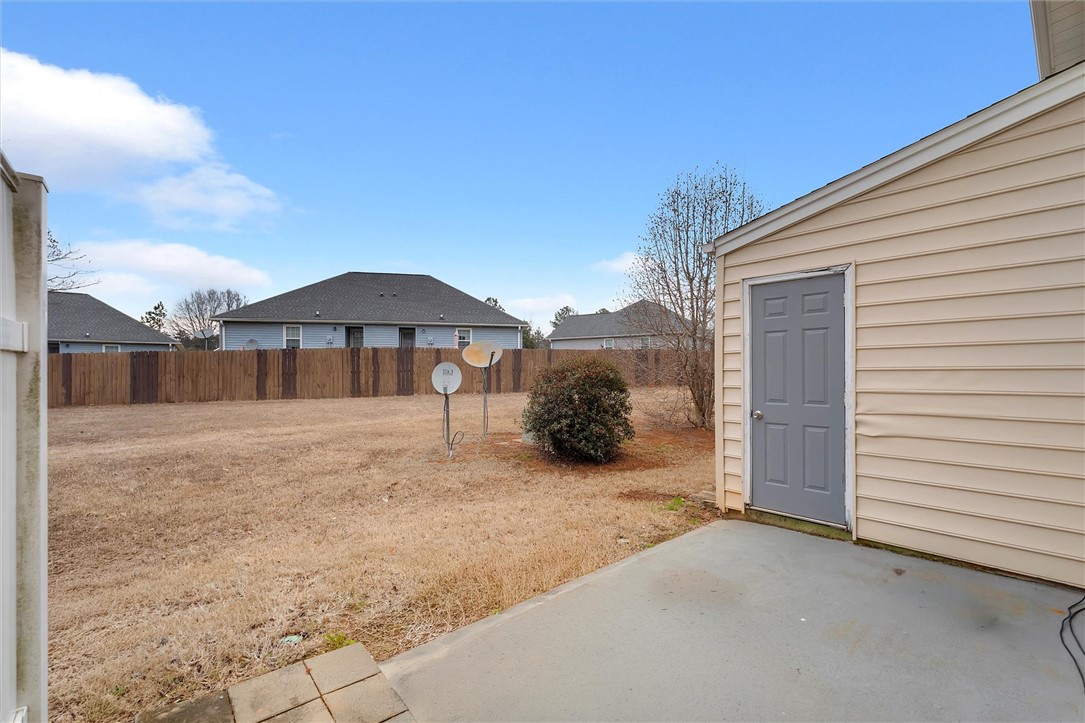 123 Trailside Lane Greenville, SC 29607 - Photo 26 of 29 This spacious backyard with a private fence offers an ideal canvas for outdoor living and entertaining.