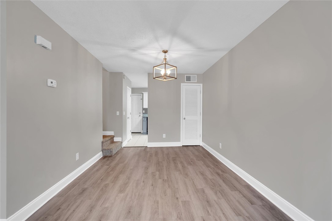 123 Trailside Lane Greenville, SC 29607 - Photo 9 of 29 This living space features durable flooring and a contemporary light fixture, perfect for modern living.