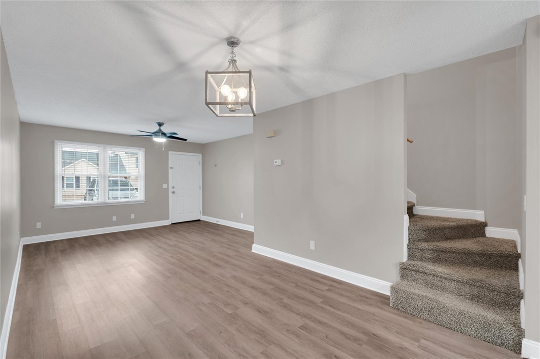 123 Trailside Lane Greenville, SC 29607 - Photo 10 of 29 This bright and airy living space features resilient flooring and convenient access to the upper level.