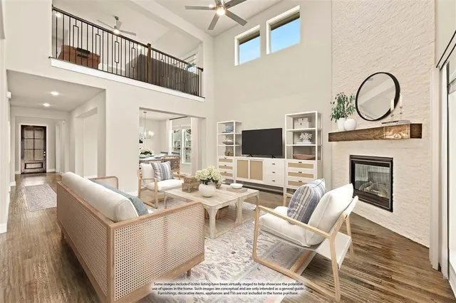 a living room with fireplace furniture and a flat screen tv