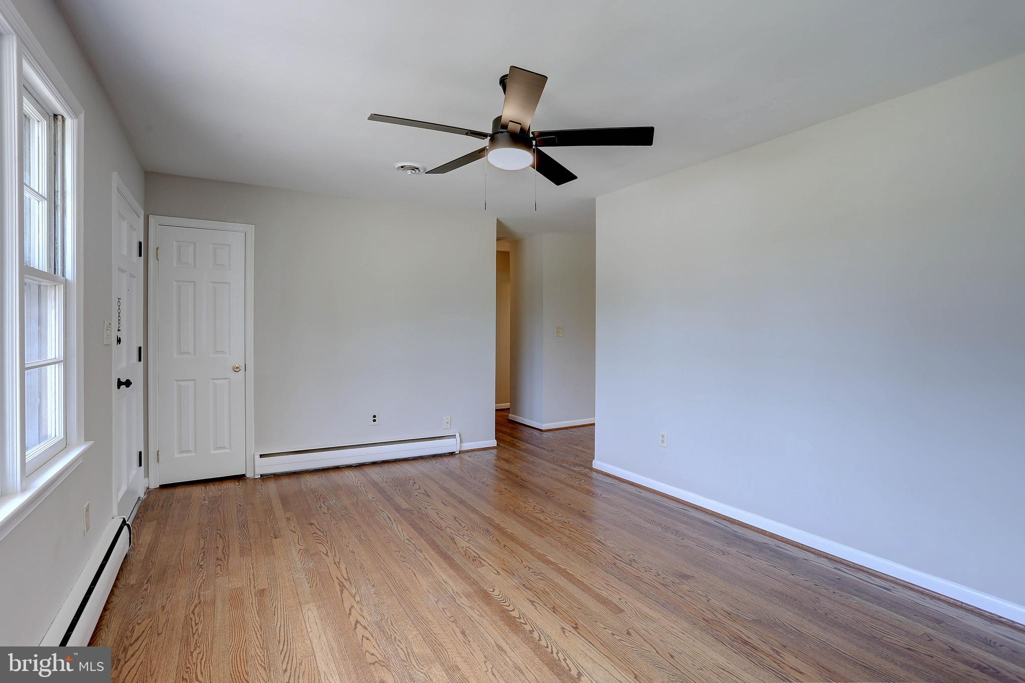 10355 Scaggsville Road Laurel, MD 20723 - Photo 11 of 41 a view of empty room with wooden floor