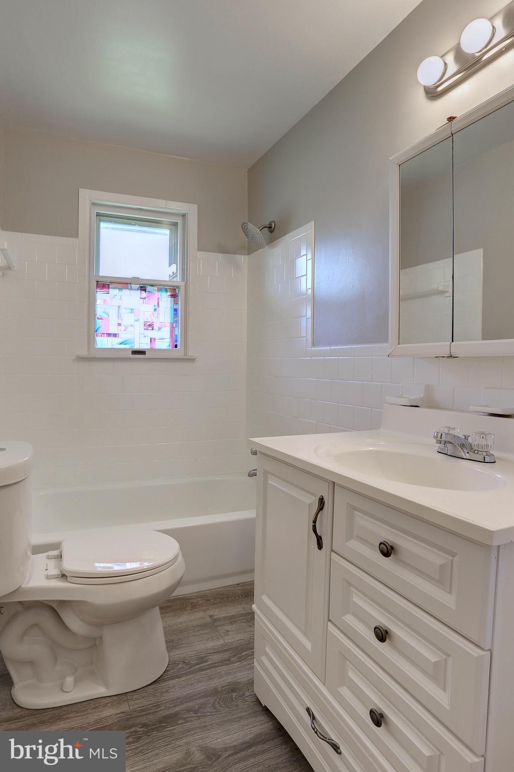 10355 Scaggsville Road Laurel, MD 20723 - Photo 14 of 41 a bathroom with a sink a toilet and a bathtub