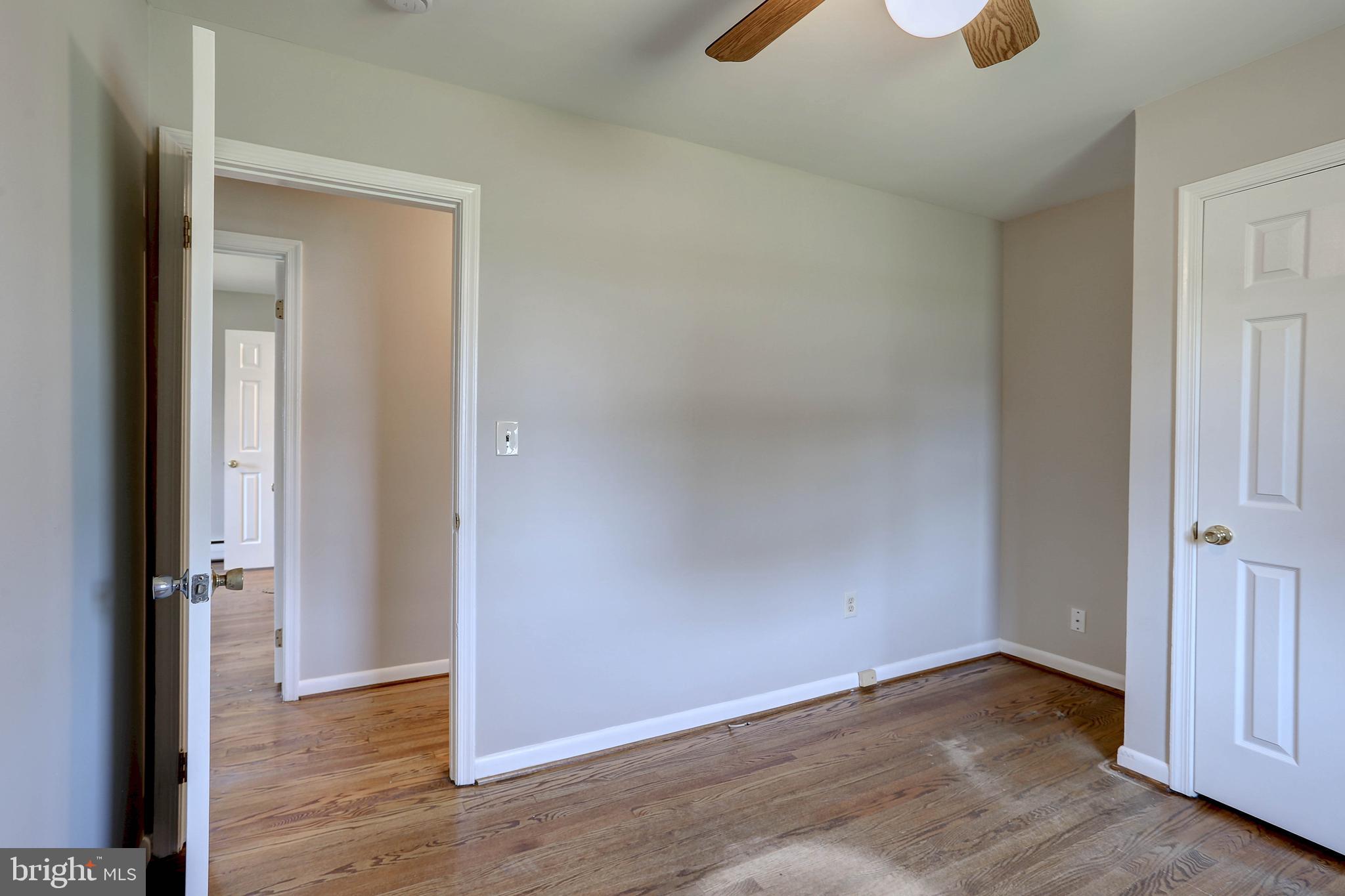 10355 Scaggsville Road Laurel, MD 20723 - Photo 16 of 41 an empty room with wooden floor