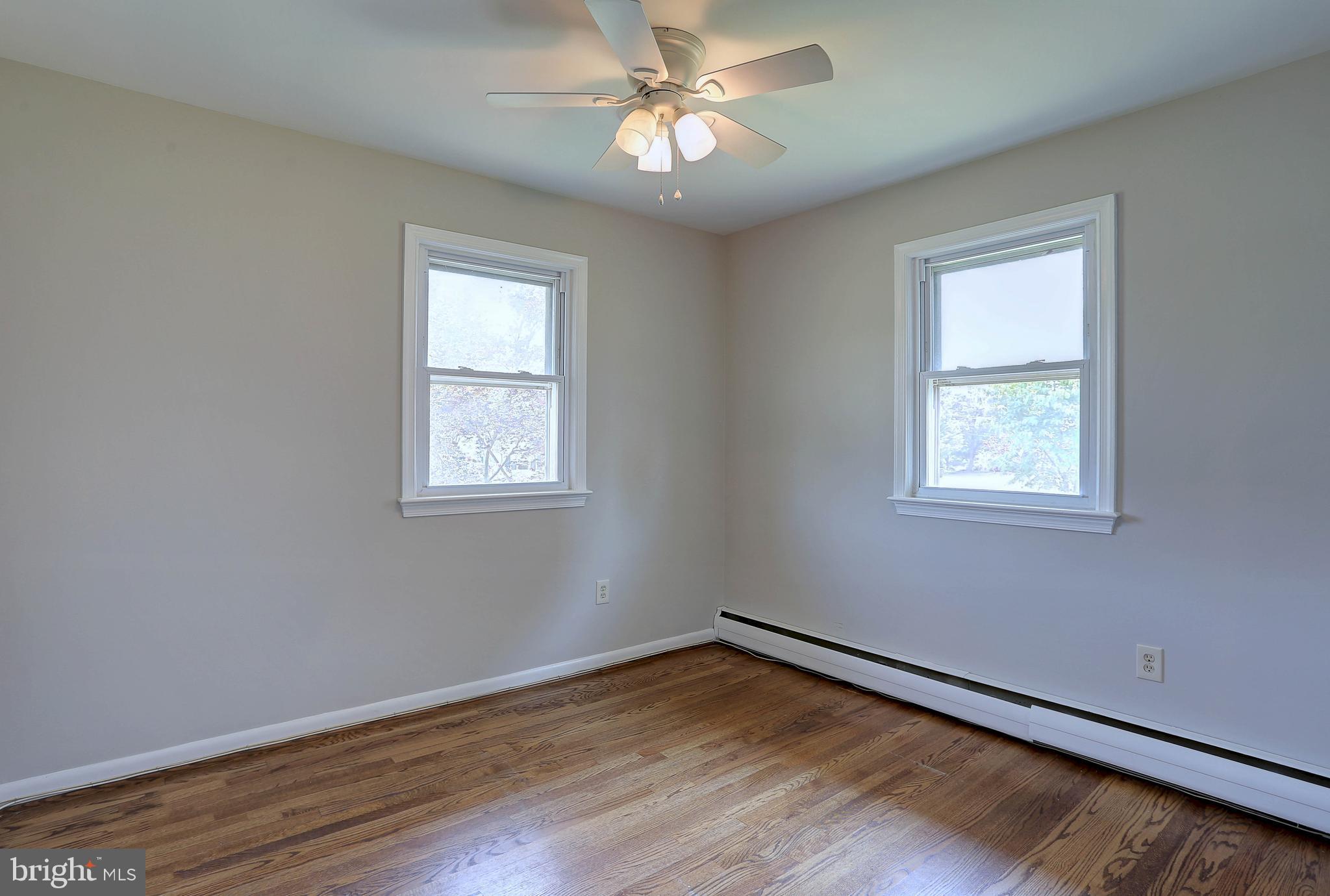 10355 Scaggsville Road Laurel, MD 20723 - Photo 17 of 41 a view of an empty room with window and wooden floor