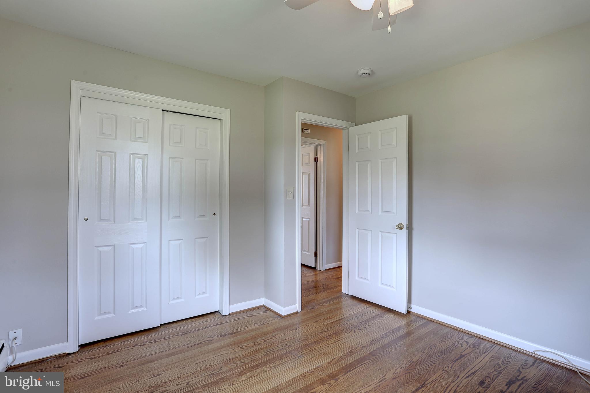 10355 Scaggsville Road Laurel, MD 20723 - Photo 18 of 41 a view of an empty room and wooden floor