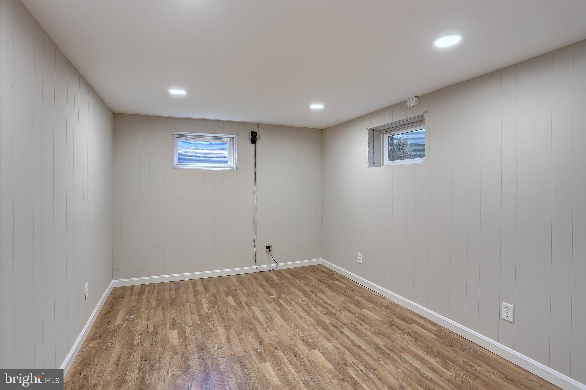 10355 Scaggsville Road Laurel, MD 20723 - Photo 26 of 41 a view of empty room with wooden floor