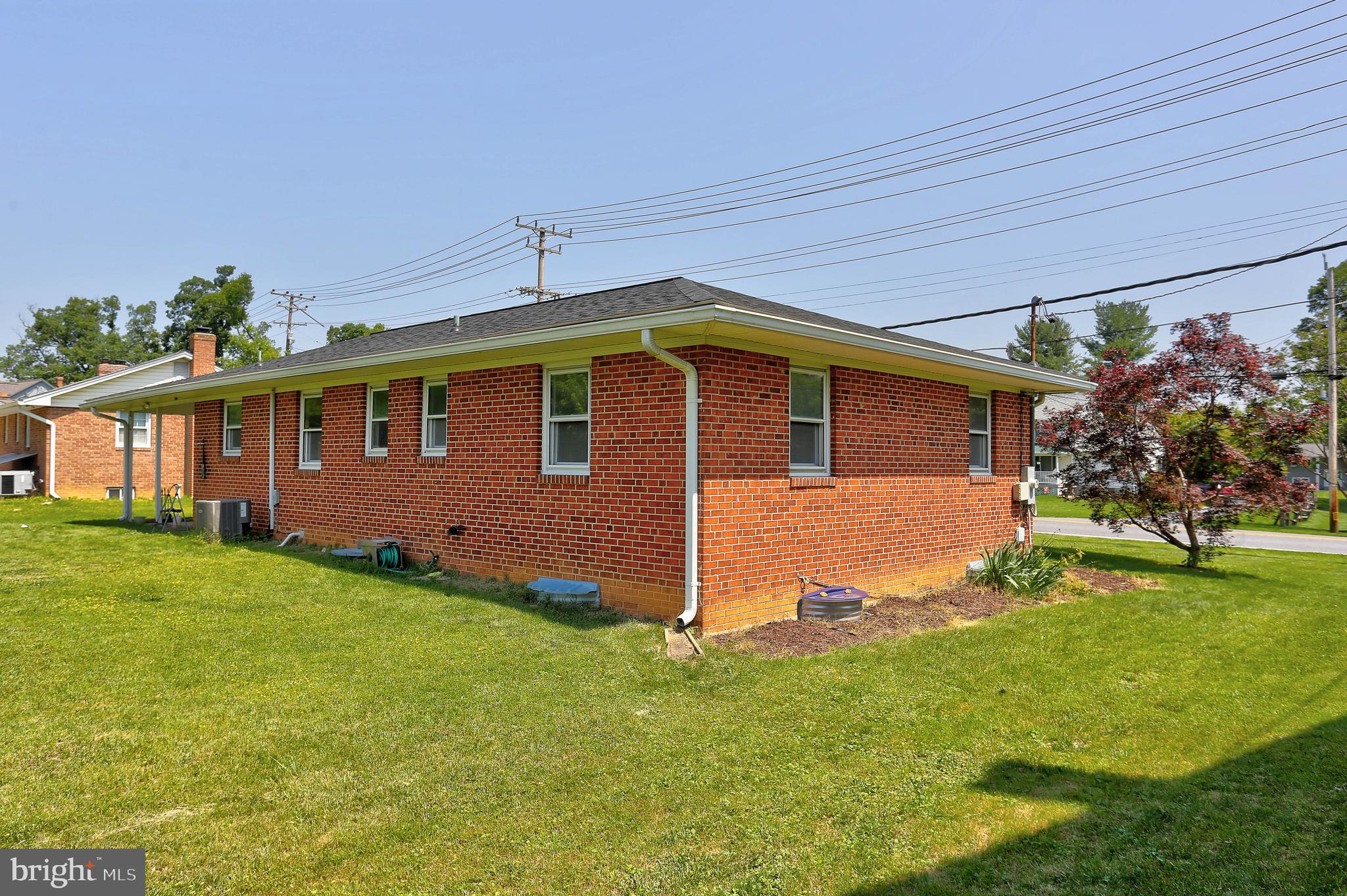 10355 Scaggsville Road Laurel, MD 20723 - Photo 32 of 41 a view of a yard in front of a house with plants and large tree