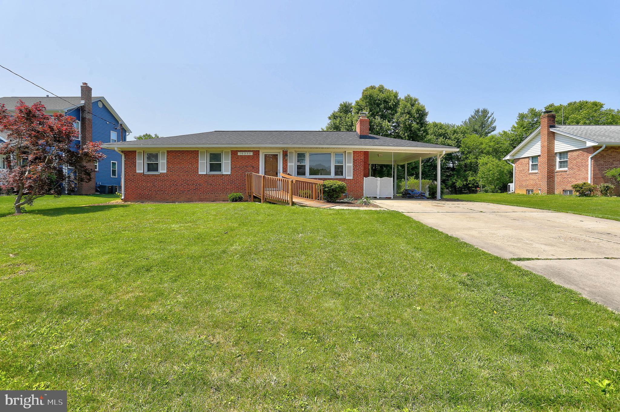 10355 Scaggsville Road Laurel, MD 20723 - Photo 34 of 41 a front view of a house with a garden