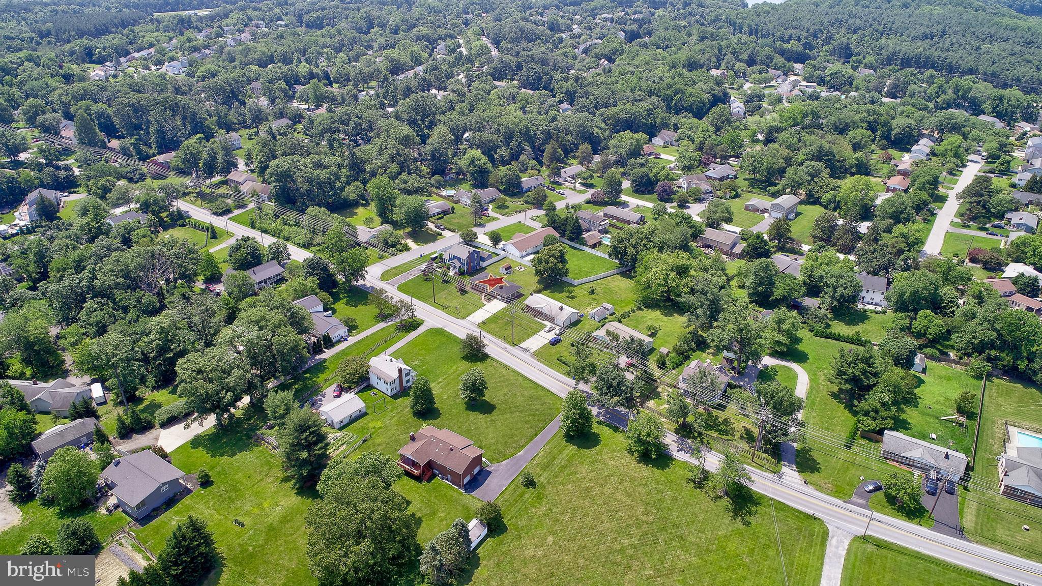 10355 Scaggsville Road Laurel, MD 20723 - Photo 40 of 41 an aerial view of residential houses with outdoor space and trees