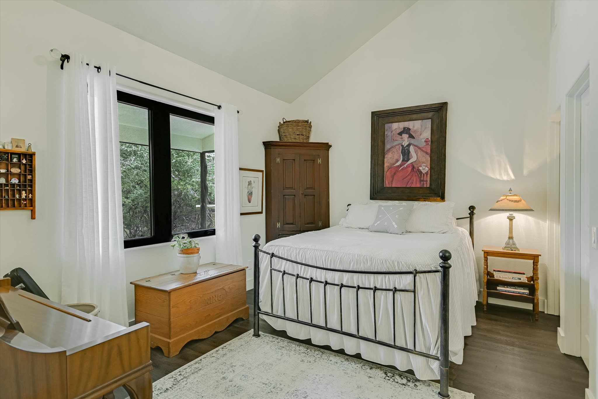 5 Sumac Court Wimberley, TX 78676 - Photo 17 of 26 a bedroom with a bed and a window