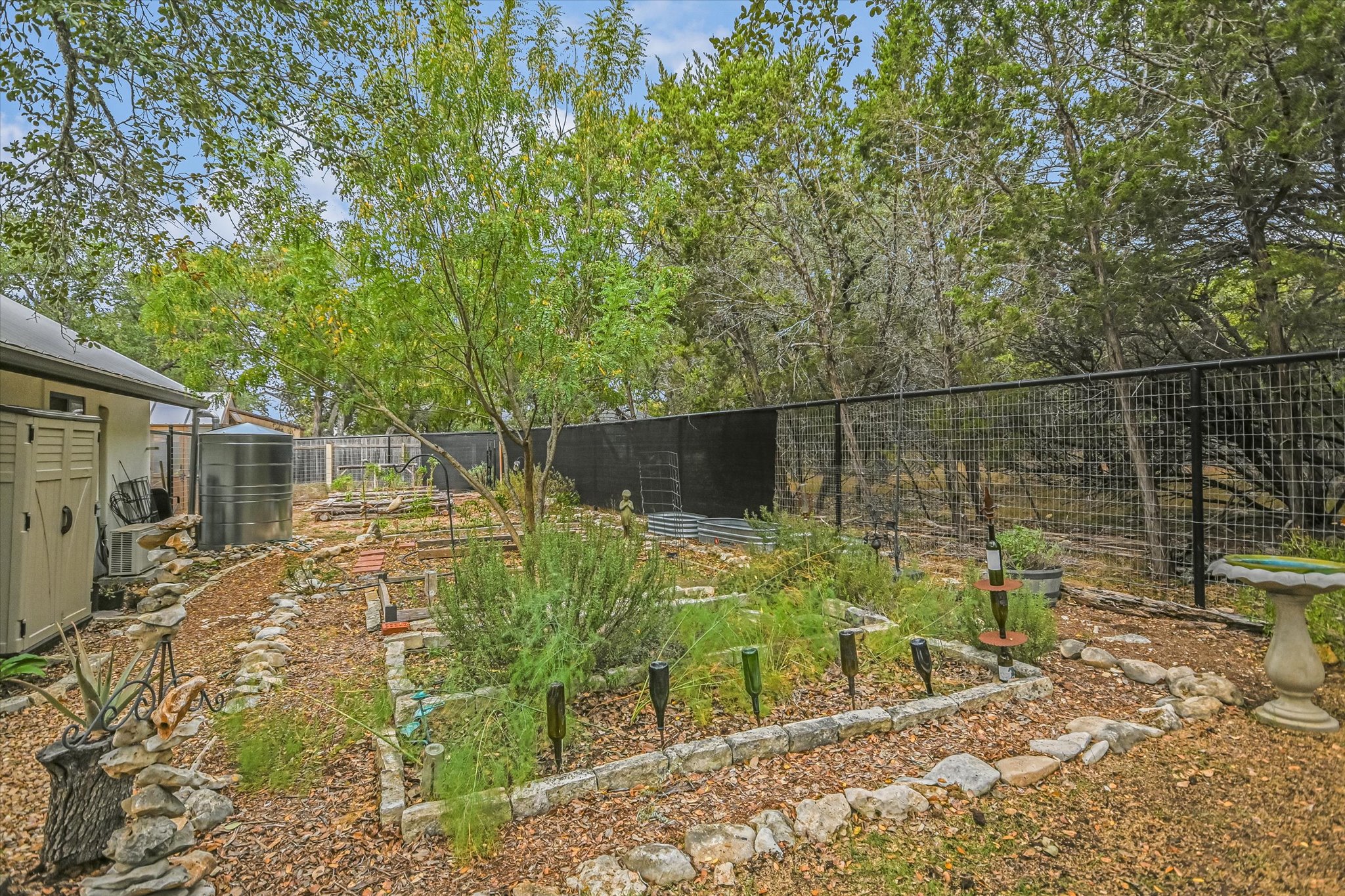 5 Sumac Court Wimberley, TX 78676 - Photo 26 of 26 a backyard of a house with lots of green space