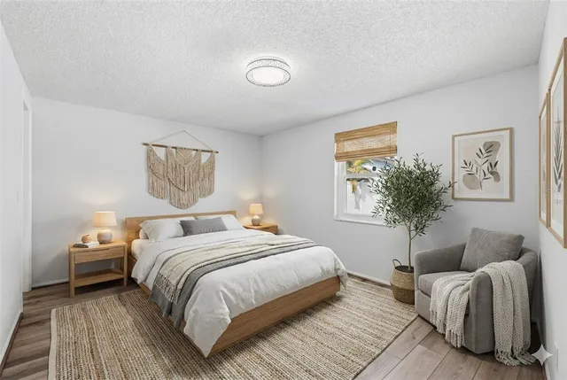 a bedroom with a bed and a couch