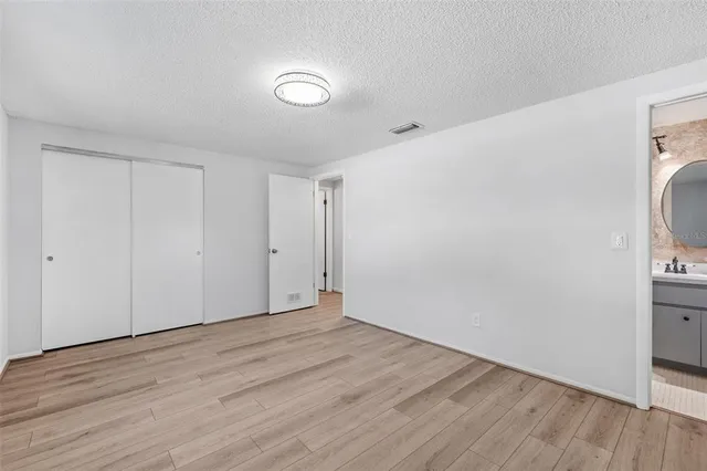 a view of hallway with wooden floor