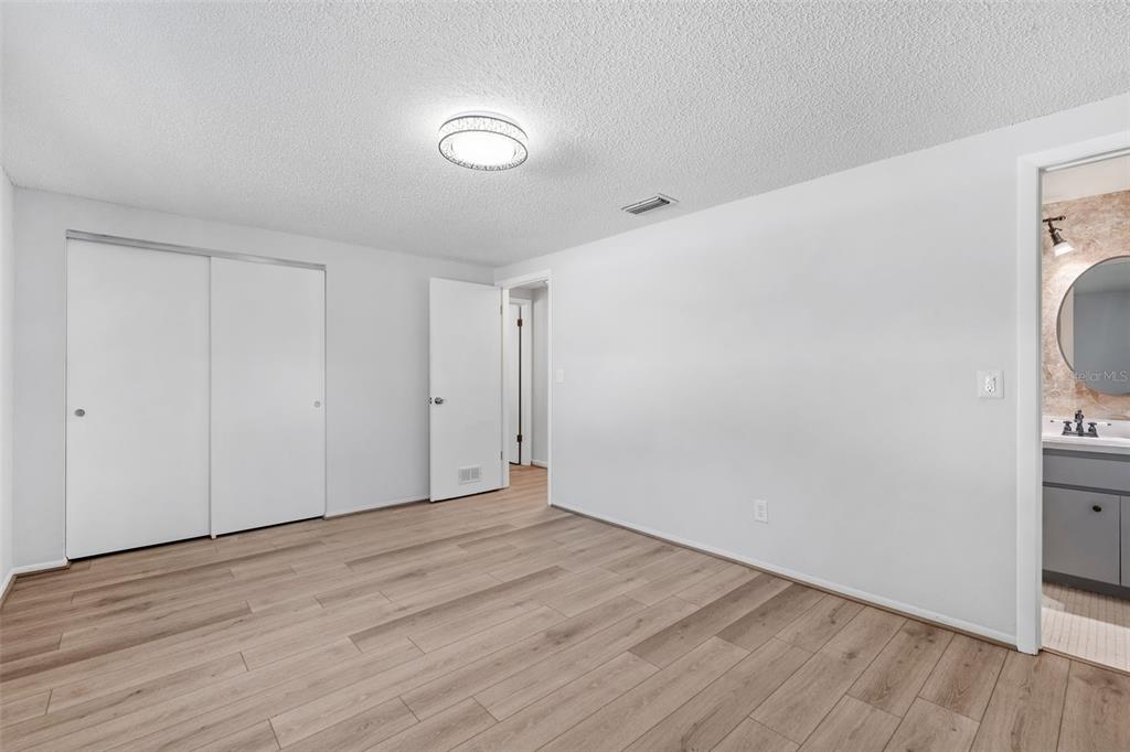 10187 122nd Avenue Largo, FL 33773 - Photo 21 of 48 a view of hallway with wooden floor