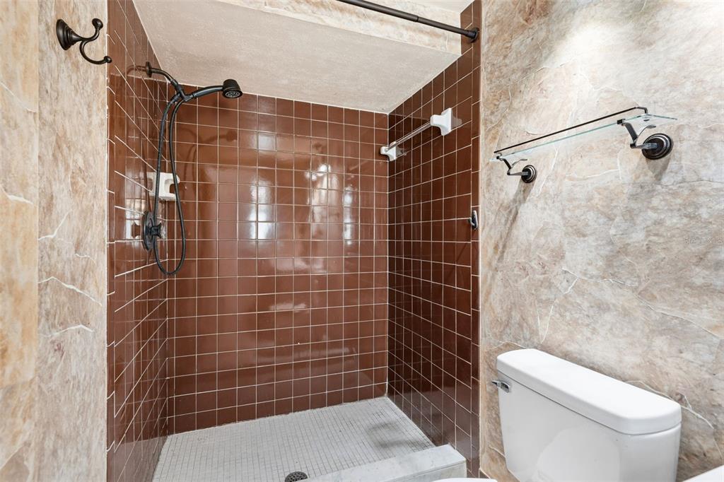 10187 122nd Avenue Largo, FL 33773 - Photo 24 of 48 a bathroom with a shower toilet and sink