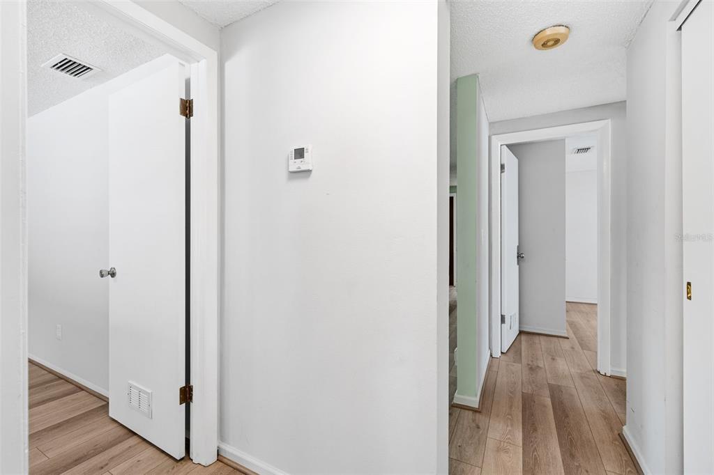 10187 122nd Avenue Largo, FL 33773 - Photo 25 of 48 a view of a hallway with wooden floor