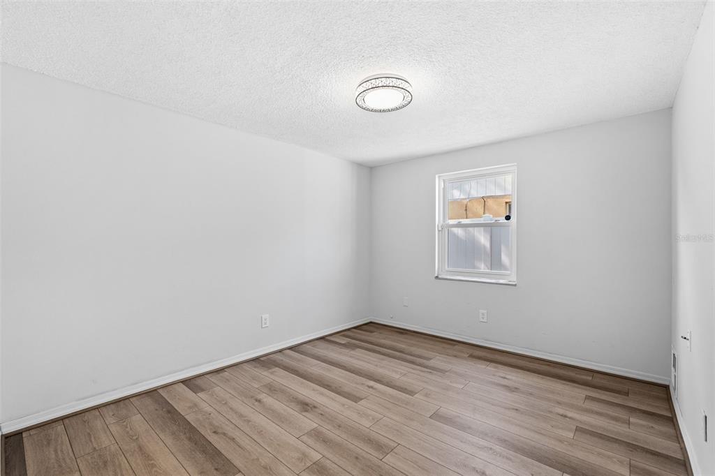 10187 122nd Avenue Largo, FL 33773 - Photo 33 of 48 wooden floor in an empty room